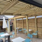 Outdoor seating area with wooden pergola