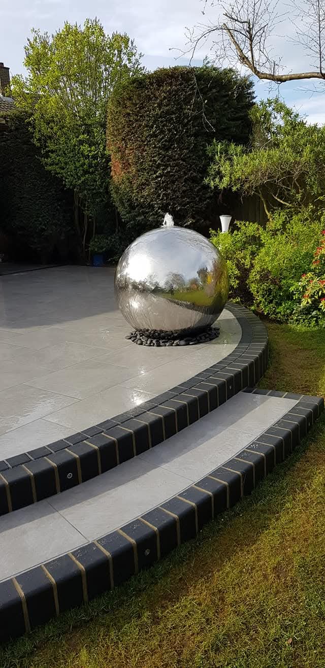 Reflective sphere fountain in garden