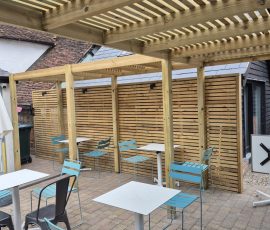 Outdoor seating area with wooden slats