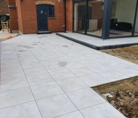 Newly paved patio beside modern house