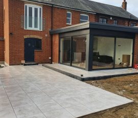 Modern patio with glass extension.