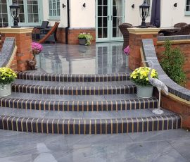 Elegant stone steps with colorful flowers.